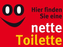 Ein Smiley und der Text "Hier finden Sie eine nette Toilette".