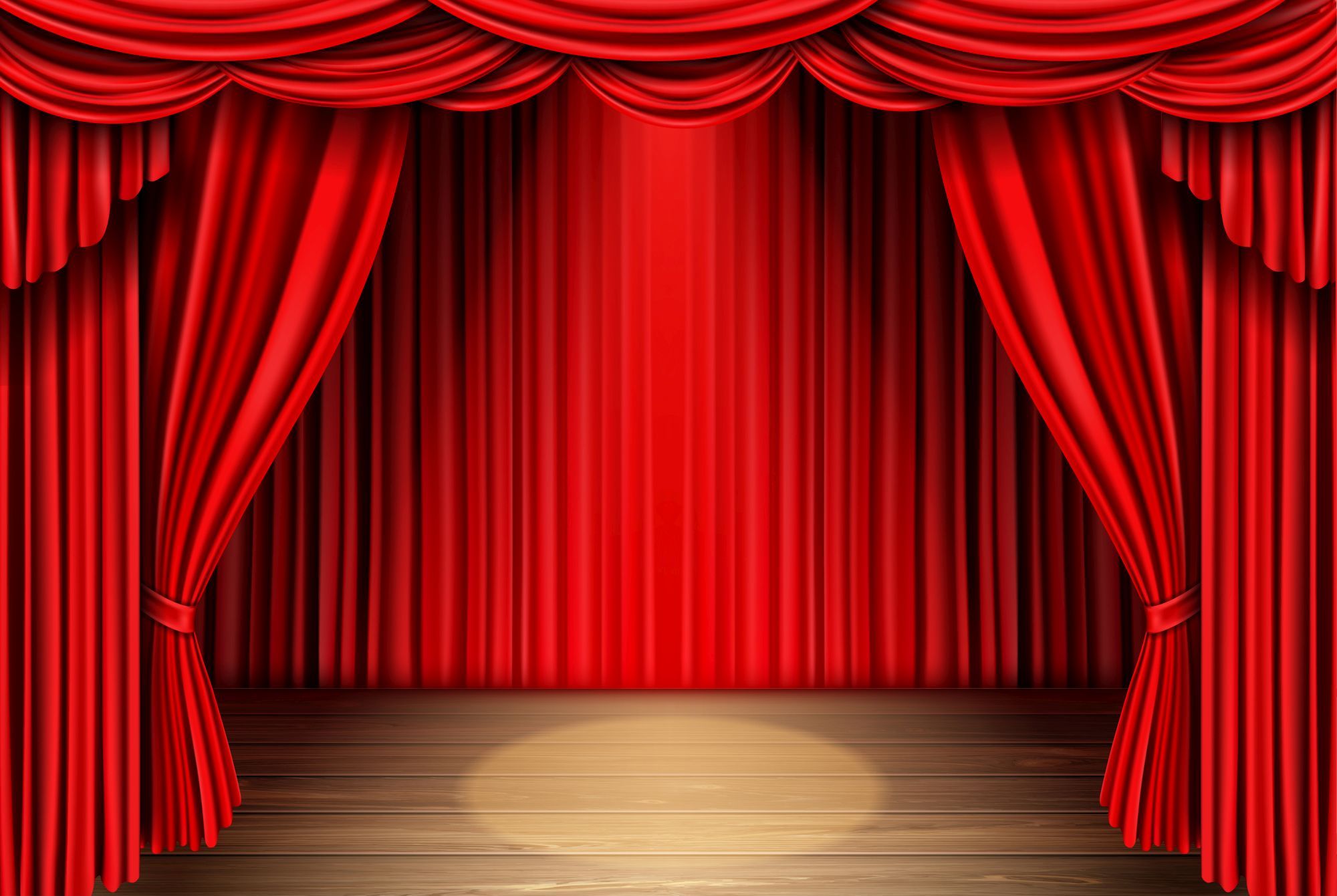 Eine Theaterbühne mit einem roten Vorhang.