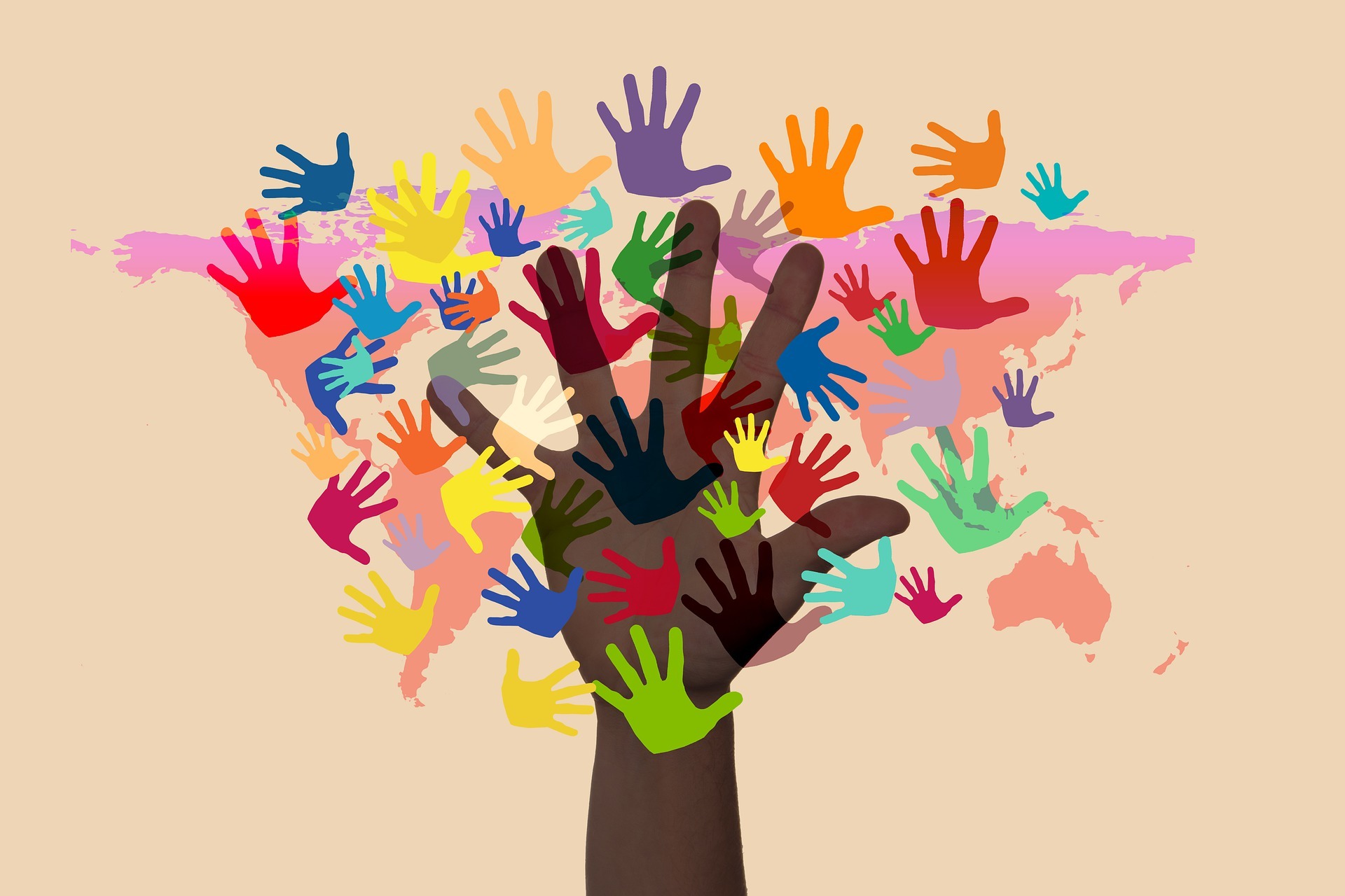 Viele bunte Handabdrücke, die einen Baum bilden.