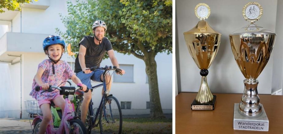 Ein Vater und seine Tochter auf einem Fahrrad. Daneben die zwei zu gewinnenden Wanderpokale.